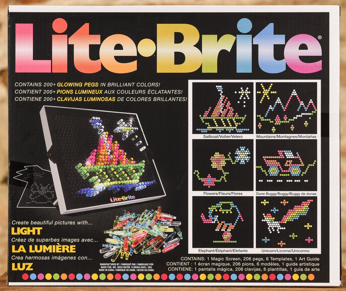 Lite-Brite lets you create art with light using design templates and bright,  colorful pegs - then lights it up like a neon sign, By Basic Fun Toys